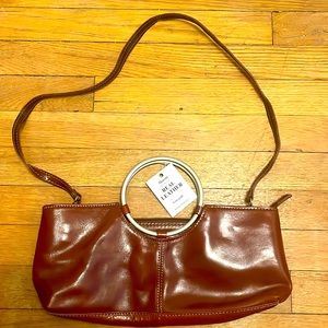 NWT, made in Italy. Chestnut brown, unique shape purse